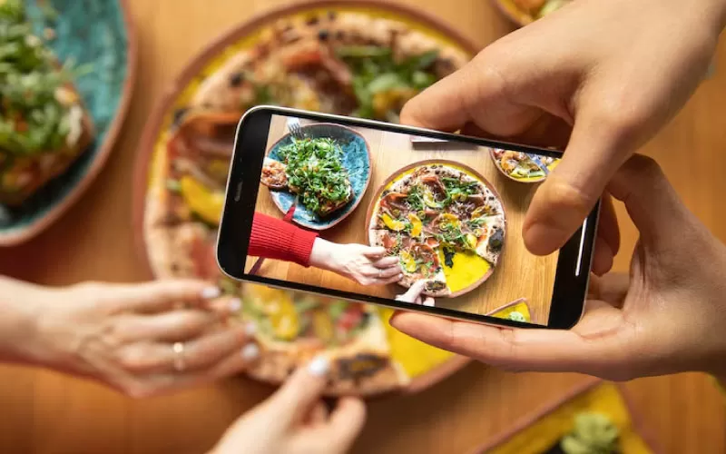 friends eating at a colourful, long dining table, international food scene, August 2024, Australia