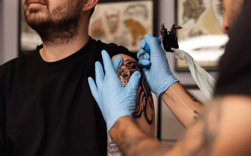 guy or gal getting a tattoo, tattoo studios, October 2024, Australia